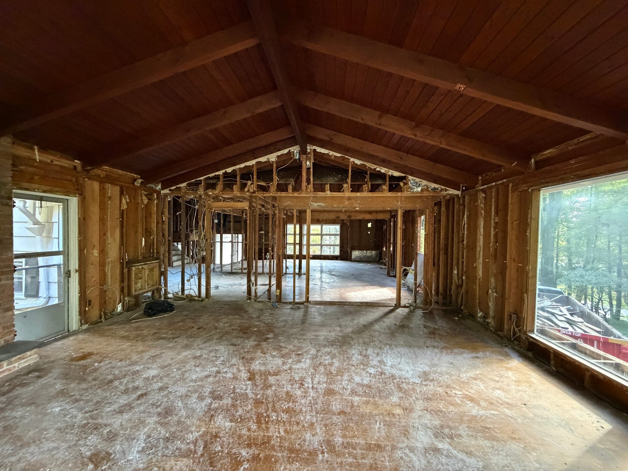 65 Windmill Road: Cathedral ceiling and exposed beams over a main level opened to the studs